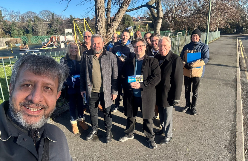 A group of conservative voters gather together smiling at the camera