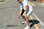 Cllr Sandu pointing out roads marked for repair. 