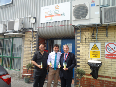 David Evennett MP with Akar Necai, an employee at the factory, and Paul Fraser.